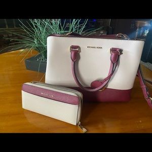 Light pink and maroon Michael Kors matching purse and wallet. Hardly used.